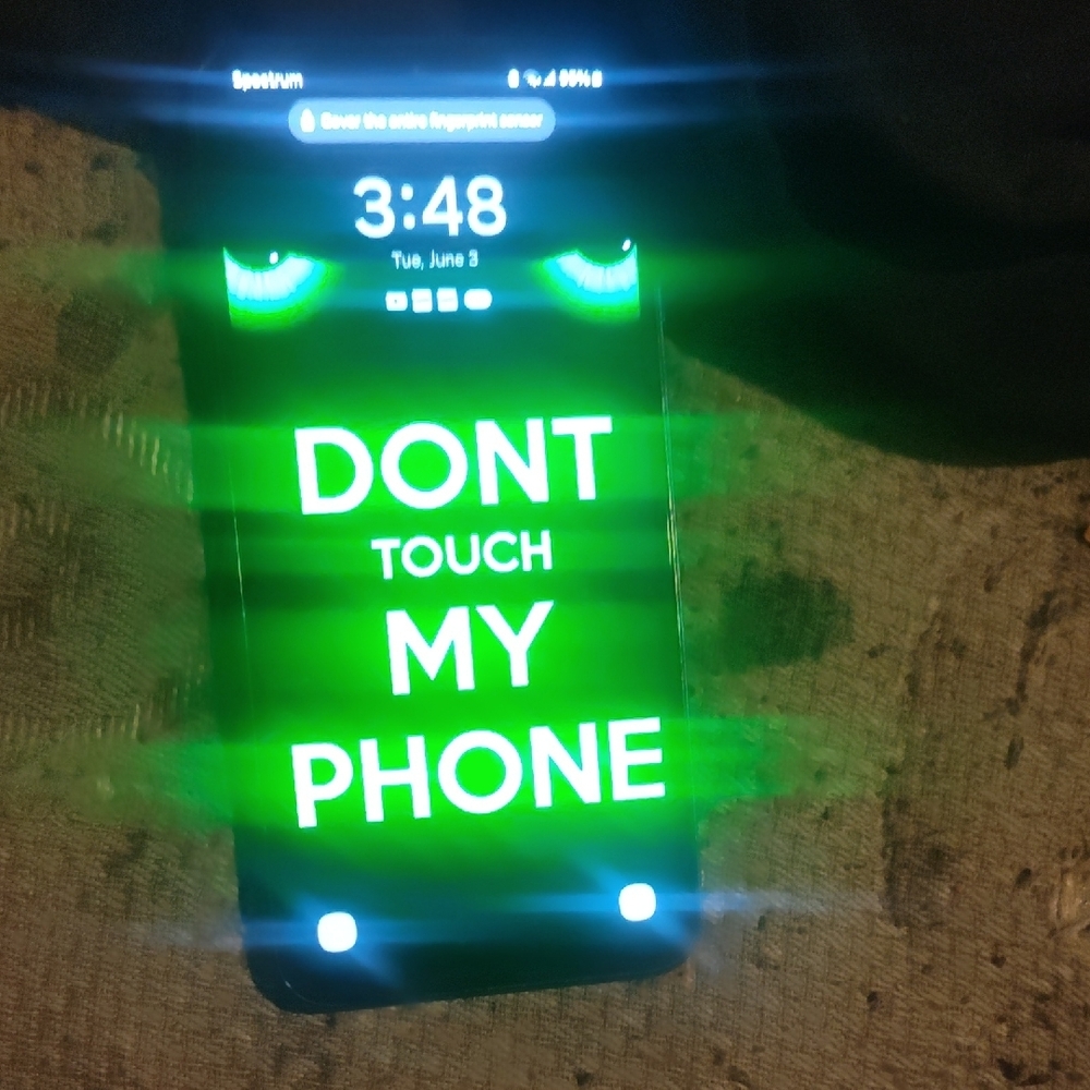 Samsung Black Cell Phone with Neon Green Display